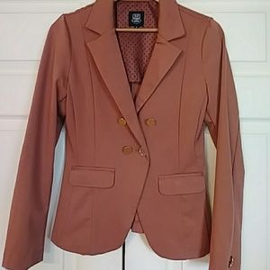 Salmon colored blazer with big gold buttons